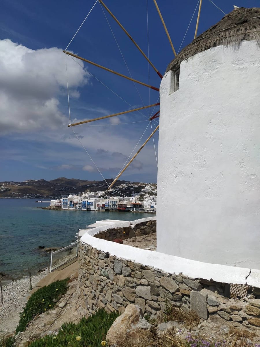 A Mykonos windmill above Little Venice and the old port.